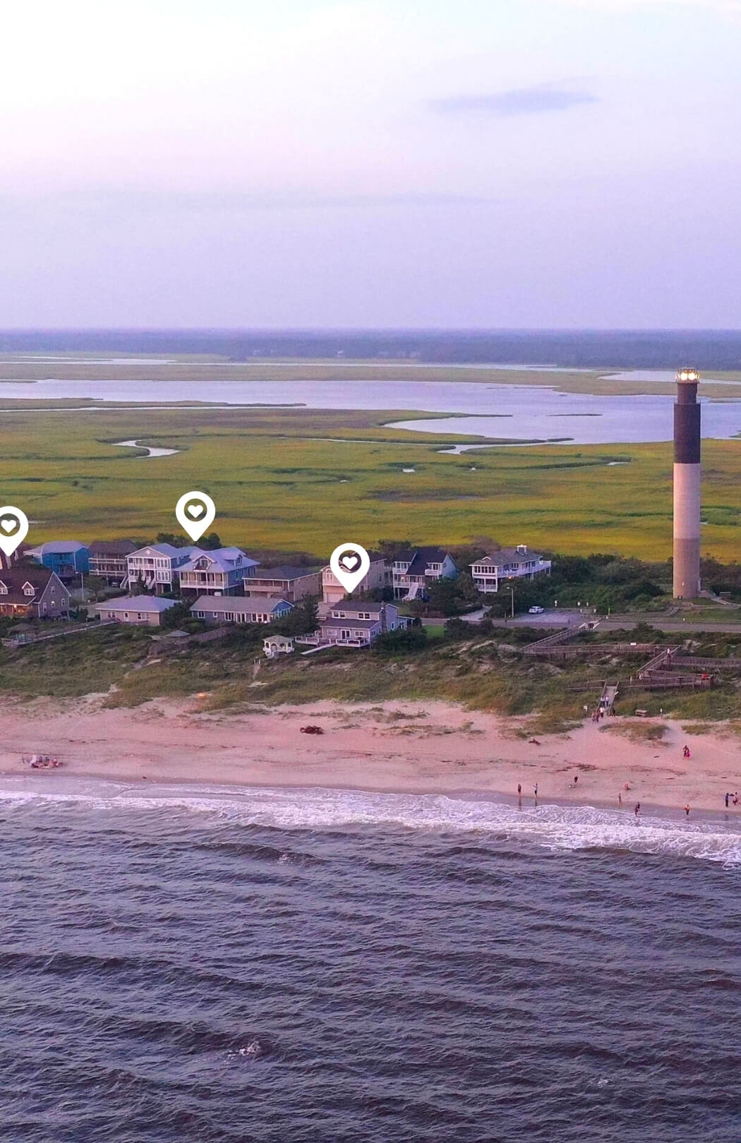 Aerial View of Oak Island Oceanfront Homes near the Lighthouse at Twilight