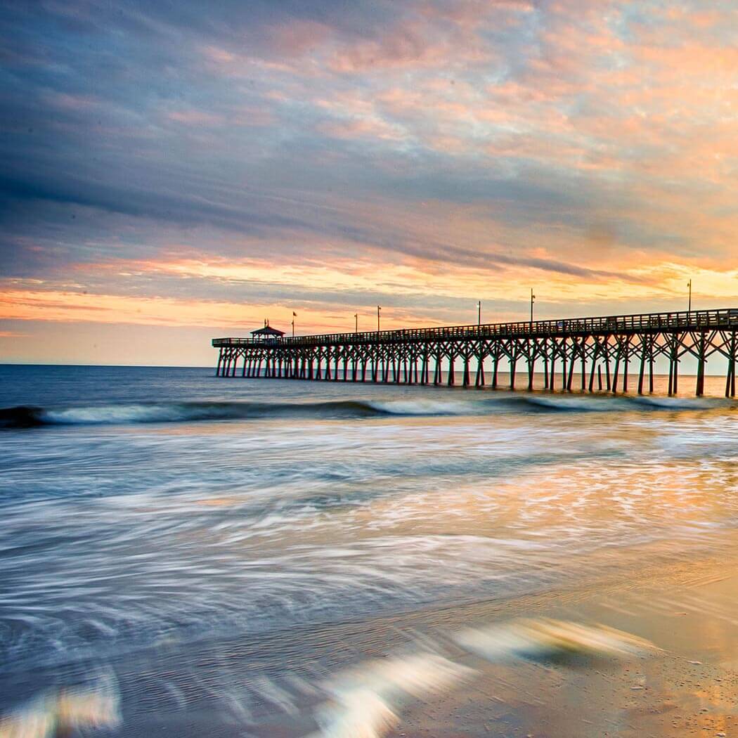 Enjoy a Fun North Carolina Coastal Vacation with Family and Relax on the Beach Overlooking the Pier at Sunset