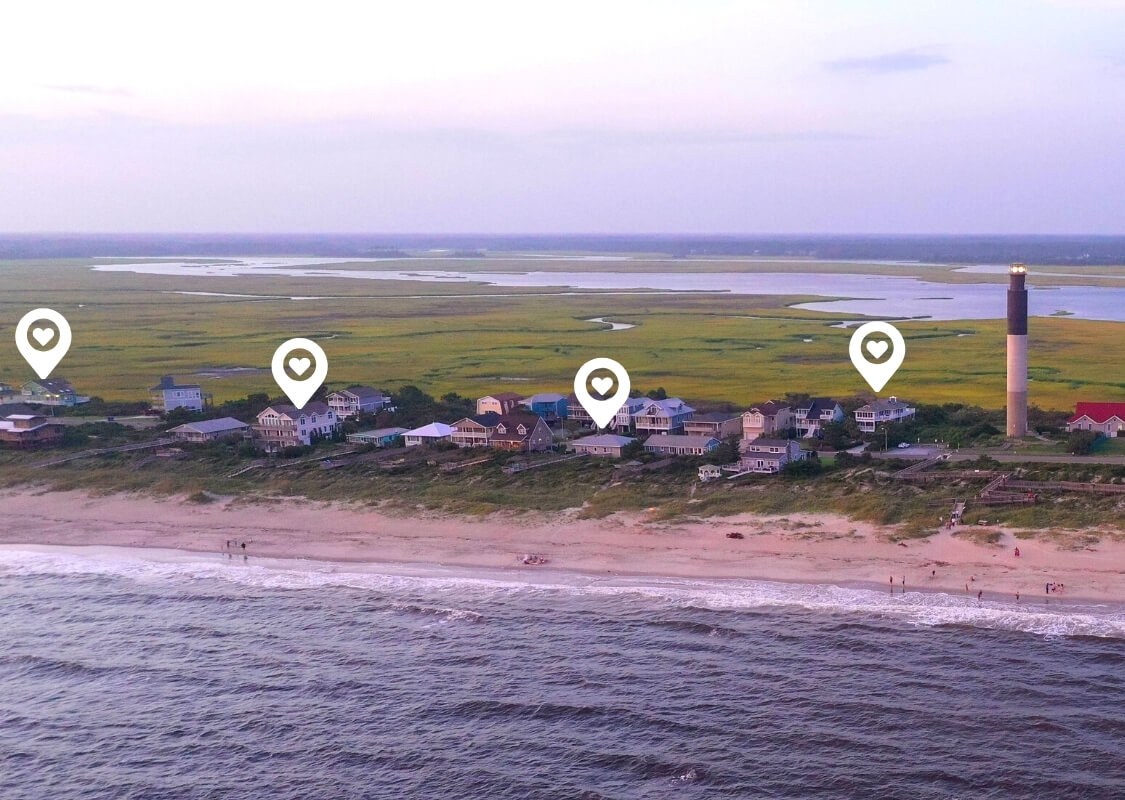 Aerial View of Oak Island Oceanfront Homes near the Lighthouse at Twilight